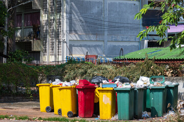 Collection area for public trash cans in the city.Row of different waste bin at the public park.Environmental protection.Garbage separation.The concept of environmental friendliness.