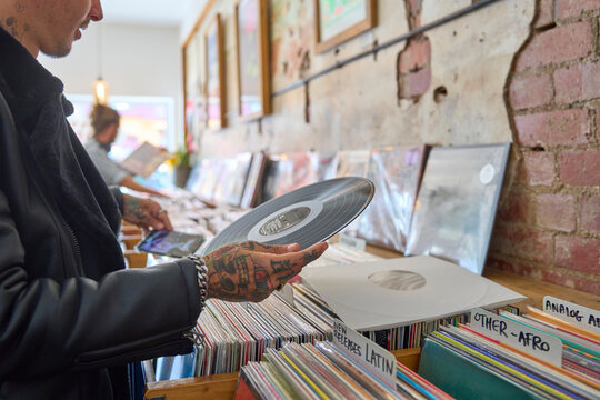 Browsing through vinyl records at a local music store