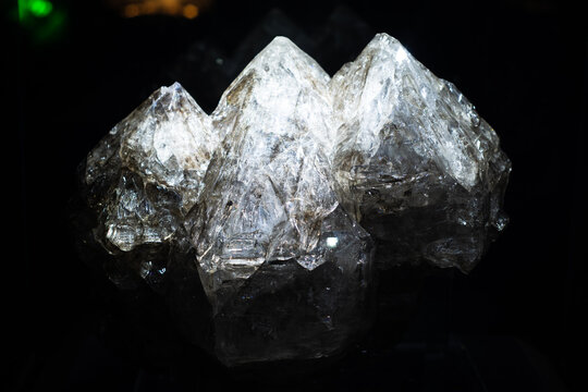 Big natural double quartz crystal isolated on black background