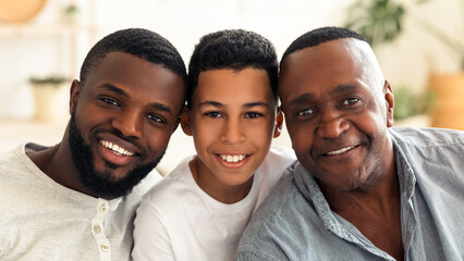 Family Members. Portrait Of Handsome African American Grandfather, Father And Son Smiling At...