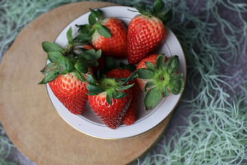 Fresh Strawberries in white bowl. Organic healthy. Summer red fruit with Copy space for text.  