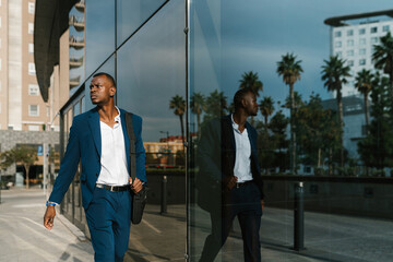 Businessman looking up in a city environment