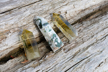 A top view image of two citrine crystal towers with a moss agate tower in the middle. 