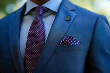 a close-up of someone's pocket square in a unique print.