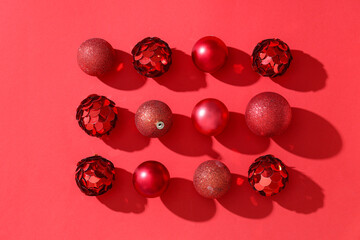 Beautiful composition with Christmas balls on red background