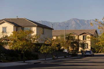 Afternoon sun shines on suburban homes of Jurupa Valley, California, USA.