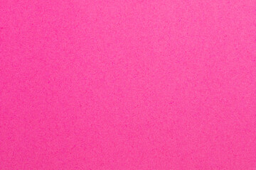 A pink background with a white dot in the middle, textured origami paper backdrop