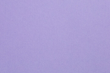 A purple background with a white line, textured origami paper backdrop