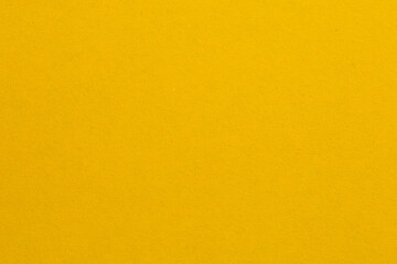 Fototapeta premium A yellow background with a white line, textured origami paper backdrop