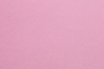 Fototapeta premium A pink background with a white object in the middle, textured origami paper backdrop