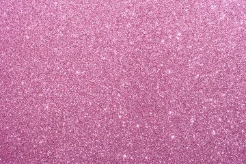 A pink background with glittery texture