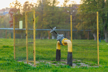 Yellow gas pipe with huge valve for supplying and transporting natural gas methane to the population