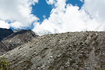 Beautiful snow-capped mountains in the landscape with people climbing to the summit in the Peruvian Andes