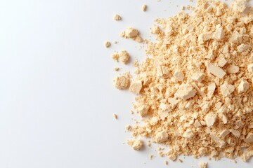 Finely ground yellow flour on a white surface for culinary use or product display.