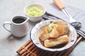 Pempek or empek-empek is a savoury Indonesian fishcake delicacy, made of fish and tapioca, from Palembang, South Sumatera, Indonesia. Pempek is served with rich sweet and sour sauce called cuko