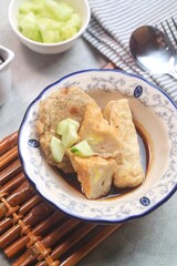 Pempek or empek-empek is a savoury Indonesian fishcake delicacy, made of fish and tapioca, from Palembang, South Sumatera, Indonesia. Pempek is served with rich sweet and sour sauce called cuko