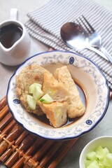 Pempek or empek-empek is a savoury Indonesian fishcake delicacy, made of fish and tapioca, from Palembang, South Sumatera, Indonesia. Pempek is served with rich sweet and sour sauce called cuko