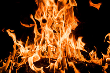 Fire flames on black background. Abstract blaze fire flame texture for banner background. Fire...