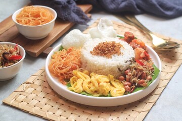 Nasi gurih is an Indonesian steamed rice cooked in coconut milk and spices dish originally from north Sumatera, Indonesia. So delicious
