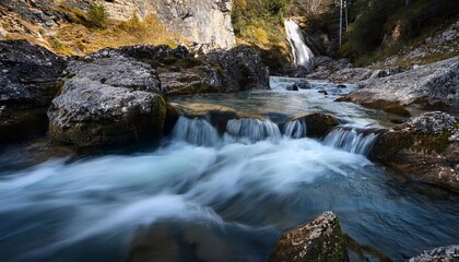 Clear Mountain Stream with Waterfall in Lush Forest