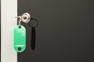 Modern locker with bright key, closeup view
