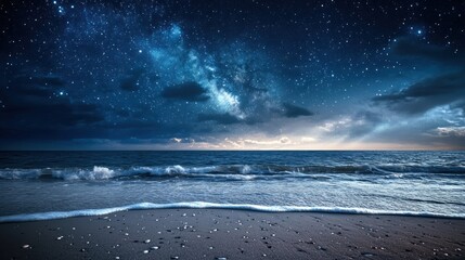 A starry night sky over a quiet beach with gentle waves.