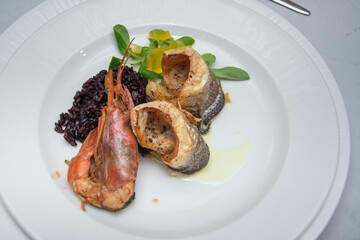 fried seafood platter. Shrimp, , fish and rice
 black, gelatin and vegetables
