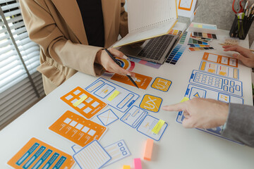 Web designers are working hard to design the appearance of digital products that are colorful,...