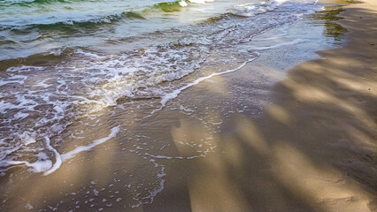Beautiful soft wave on sandy beach. Summer vacation concept