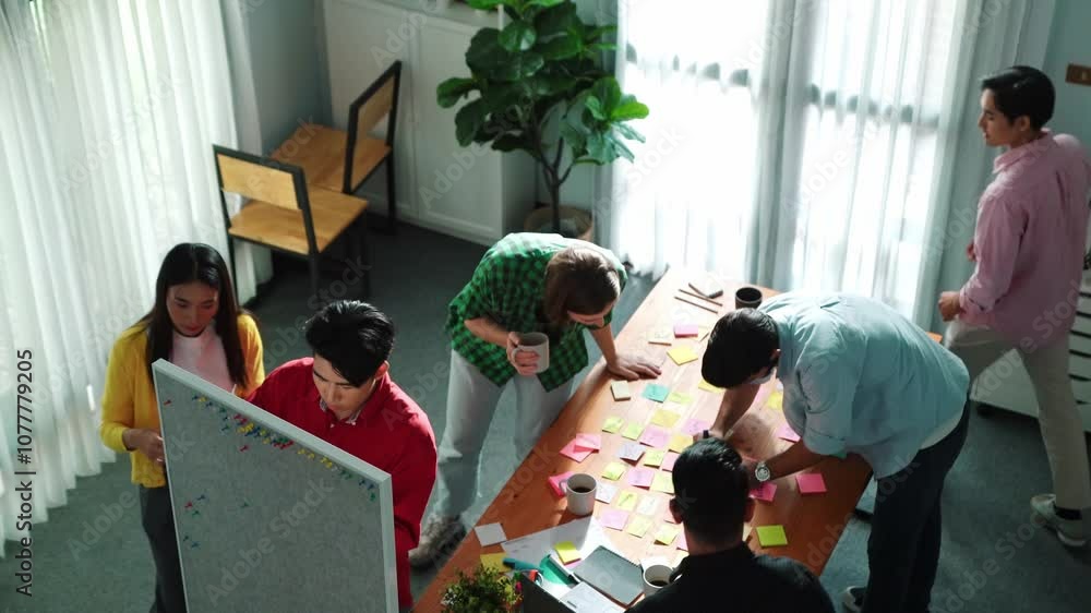 Poster top view of diverse business people writing and stick sticky notes at whiteboard. creative team work