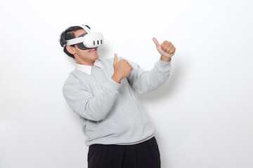Portrait of Asian man using virtual reality VR device, experiencing immersive technology. Isolated image on white background