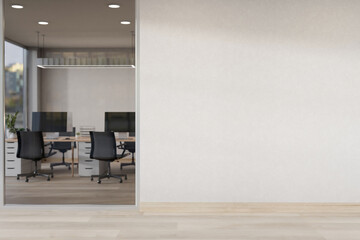 The interior design of a modern, minimalist office corridor features a blank white wall.