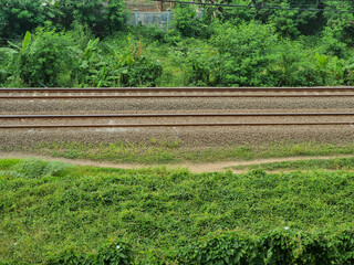 Commuter line railway tracks, photographed from the top of a building. high angle shot