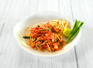Savor the delight of freshly made pad thai with shrimp lime and bean sprouts