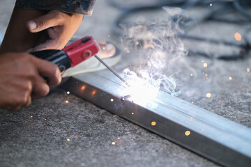 Welding of steel, sparking, not wearing gloves