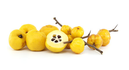 Japanese quince fruit in vibrant yellow, featuring whole and halved views isolated on white