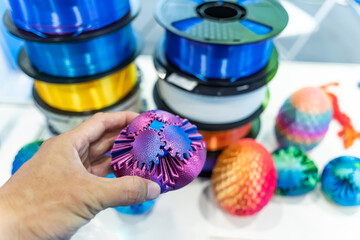 hand with gear object printed on 3d printer close-up