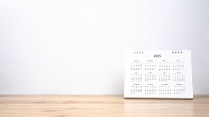 Calendar year 2025 schedule on wood table white background.
2025 calendar planning appointment...