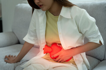 stomach ache. Asian women have abdominal pain, indigestion, gastritis, menstrual cramps,...