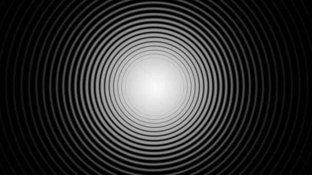 Growing and shrinking white circles on a black background animation