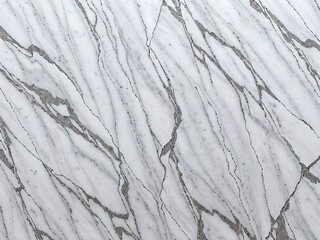 Fototapeta premium Marble texture with realistic veins and colour variations, featuring smooth patterns in natural colour. Perfect for backgrounds, design projects, and product placement.