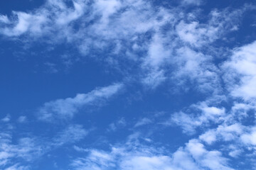 Obraz premium blue-sky abstract with some clouds on summer day .Blue and white copy-space cloudscape. Nature beauty. awesome afternoon view. Copy-space background