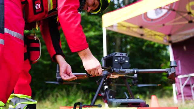 Person open and prepare propeller blades on industrial drone, Czechia