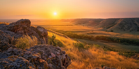 A peaceful sunrise over a distant, rugged landscape, the warm glow of the sun spreading across the untouched scenery.