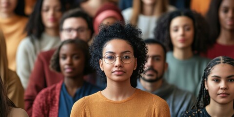 A diverse group of activists at a rally or meeting promoting disability rights