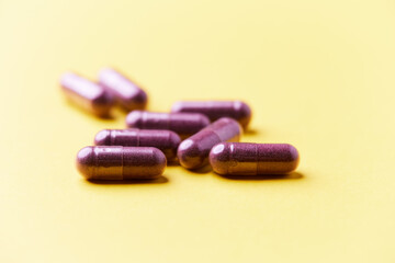 Lutein capsules. Dietary supplement on bright background. Soft focus. Close up. Copy space.	