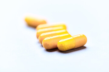 Vitamin C capsules. Bright background. Close up. Copy space.	