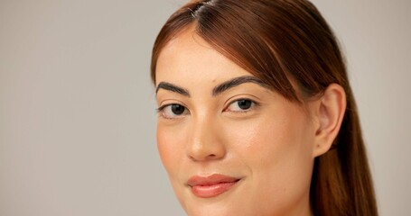 Fototapeta premium Skincare, natural beauty and portrait of woman with glow, dermatology or shine closeup on gray studio background. Face, mockup space and model with makeup, cosmetics or pimple treatment for aesthetic