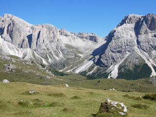 landscape in the mountains, Blue skies on a summers day in Europe Alpine region. Hiking hut-to-hut in the Dolomites.