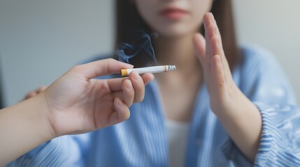 Obraz premium Woman refusing a cigarette being offered to her.